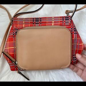Cute red plaid cross body purse.